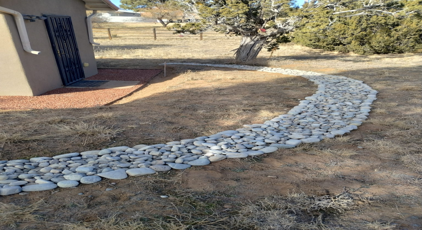 Landscape Drainage Solution: Decorative River Rock Channel