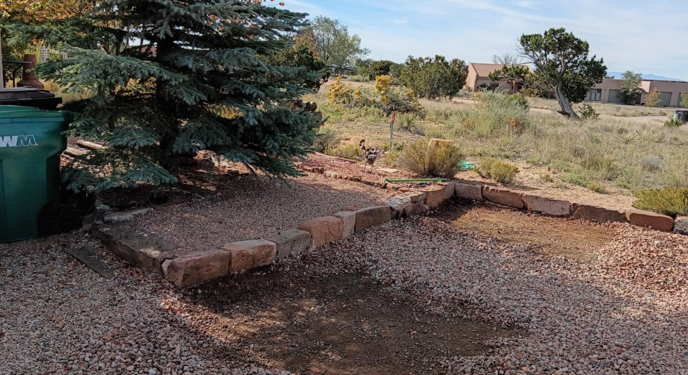 Residential Landscaping Project: Stone Retaining Edges and Gravel Surfacing